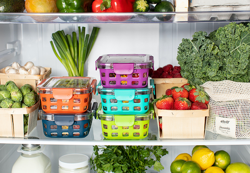 Open fridge with meals organised in lunchboxes.