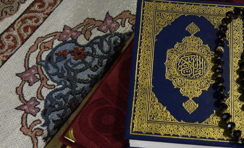 Photo of the Quran on top of the prayer mat