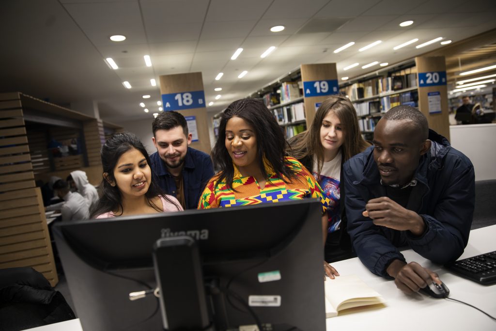 Group of students working together in the Library