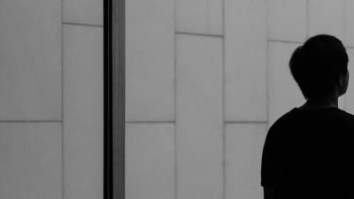 Back of a person looking through the glass