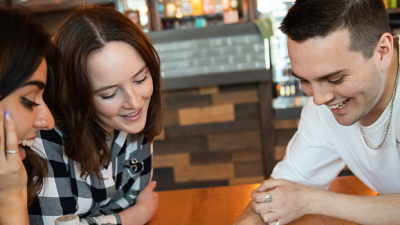 Photo of friends hanging out in a restaurant together