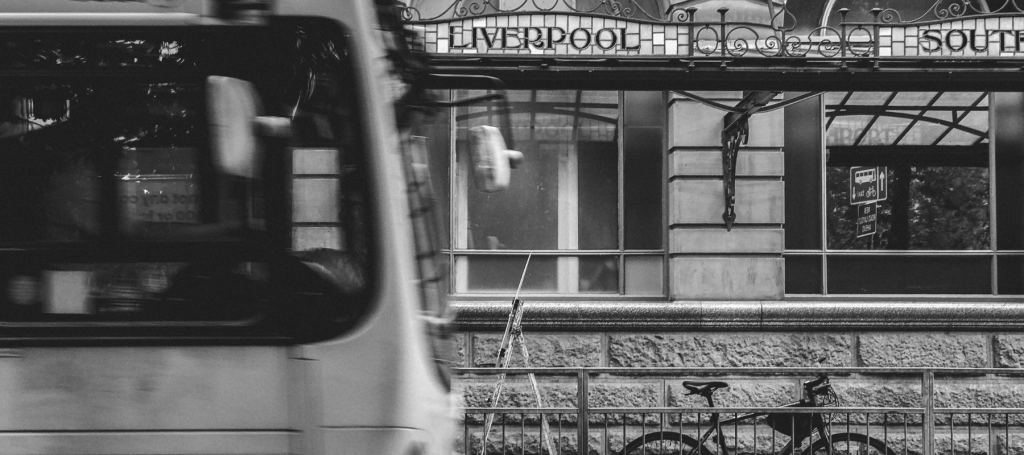 Nus driving past Manchester Victoria Train Station.