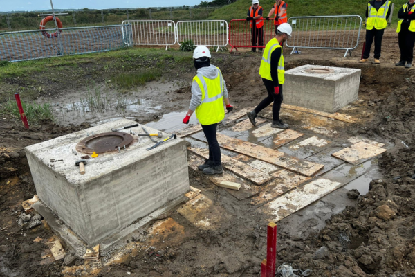 Students working on a construction site 