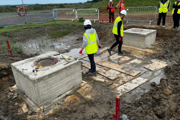 Students working as a group on a construction site