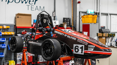 Formula Student Car with university of salford logo on it