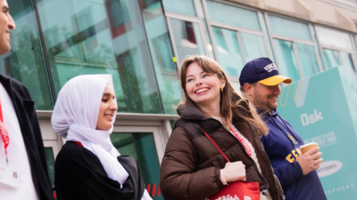 Four students leaving University House on Peel Park campus