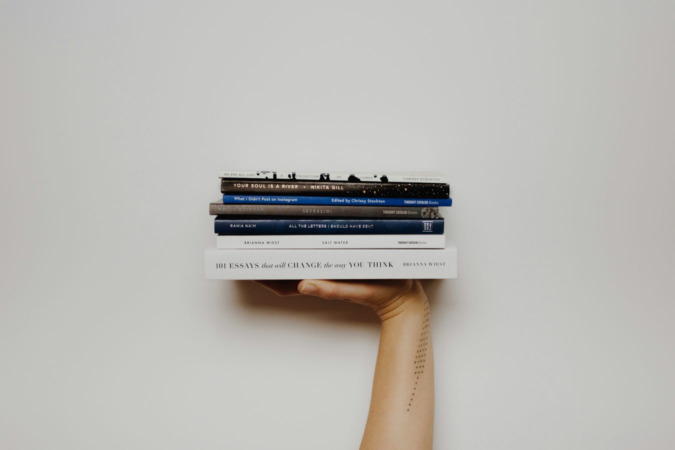 Image of a hand holding books