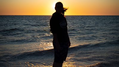 Sevim at the beach during sunset