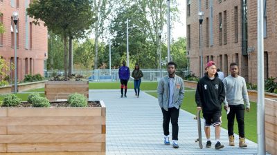 Students leaving Peel Park Quarter accommodation