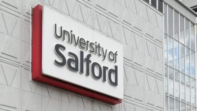 Photo University of Salford sign on the front of Maxwell Hall