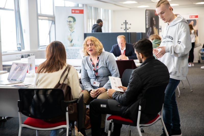 Student's receiving advice at Business School event.