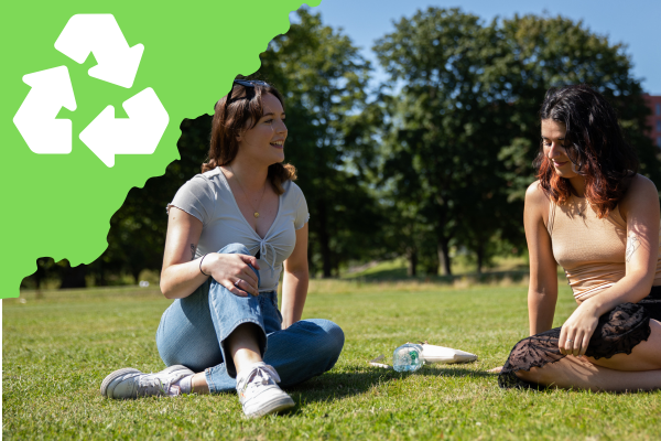 Two students in Peel Park. Sustainabilty icon.