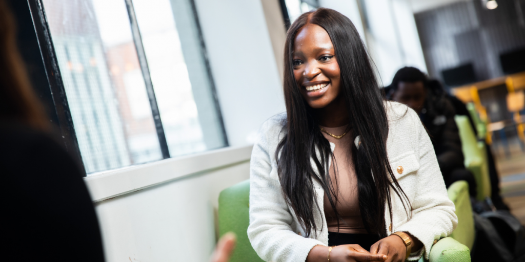 Student smiling after discussing her freelance opportunities. 