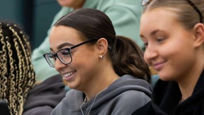 Three students in a lecture