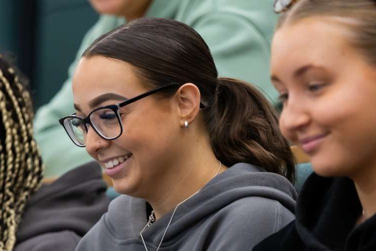Three students in a lecture