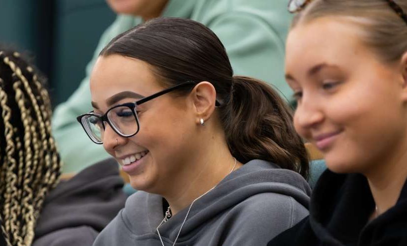 Three students in a lecture