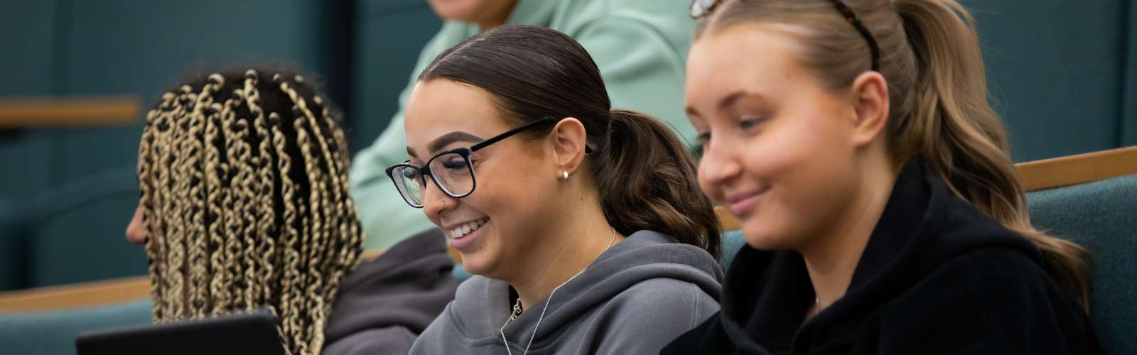 Three students in a lecture