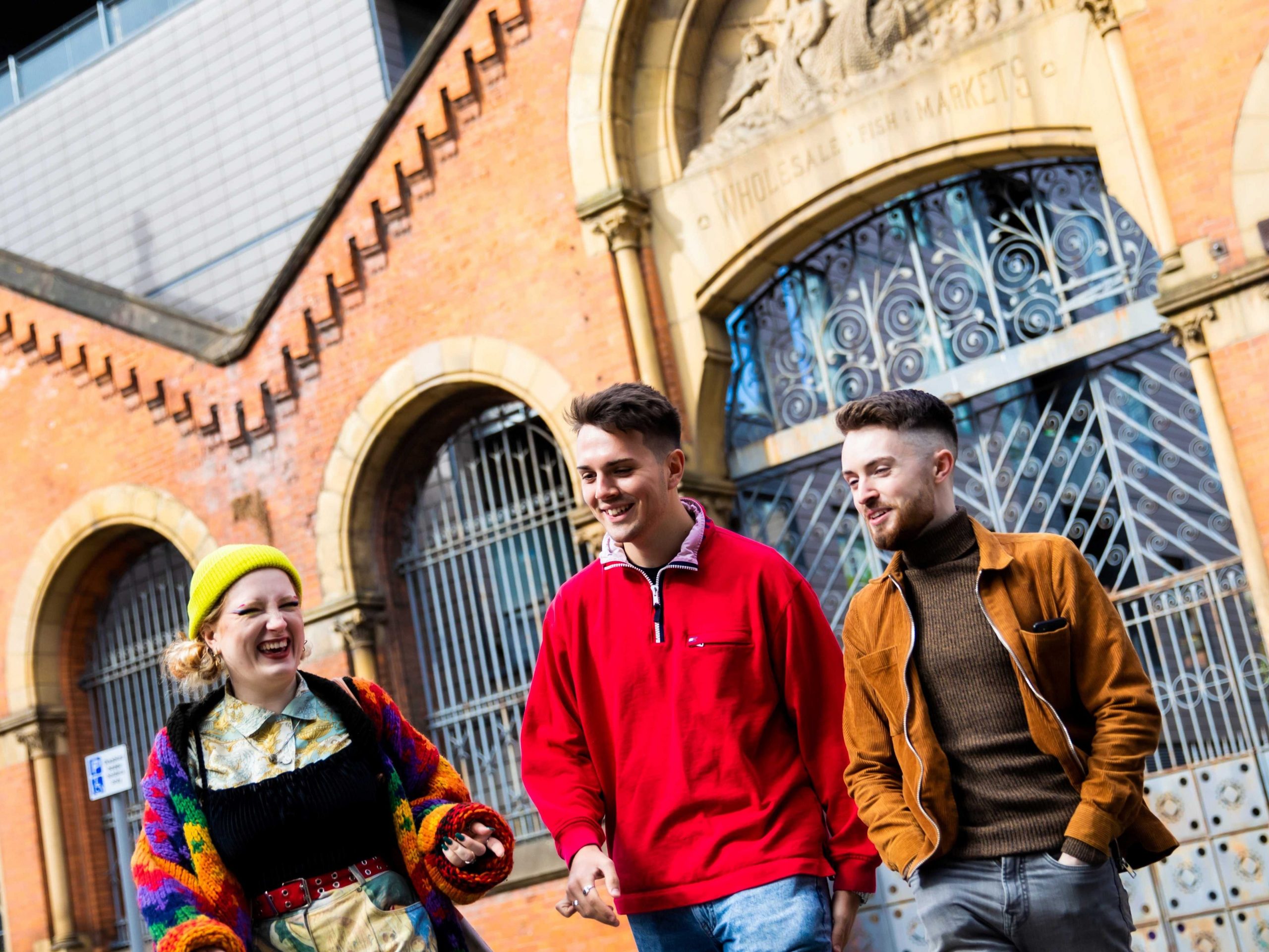 Three students walking in Manchester City Centre