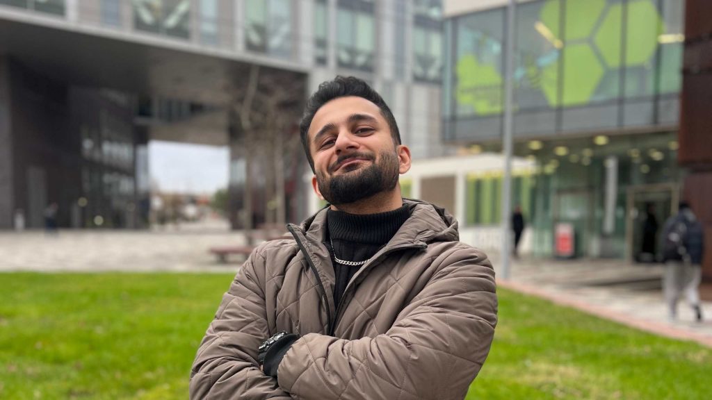 Ayaan posing in front of the New Adelphi Building.