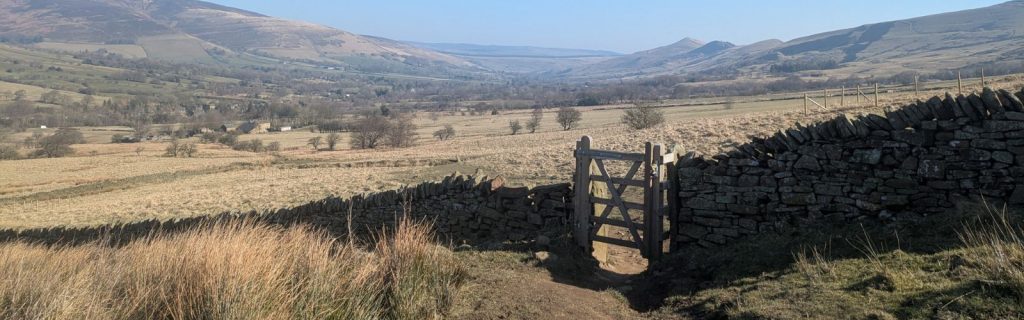 A field with hills in the Peak District