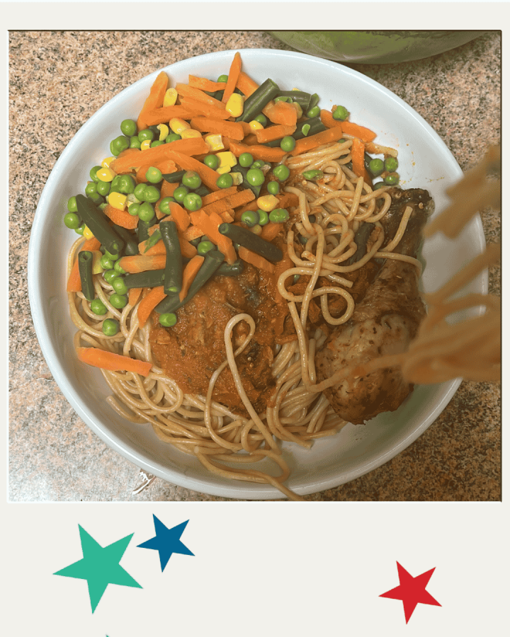 Abimbola's healthy meal, including chicken, noodles and vegetables
