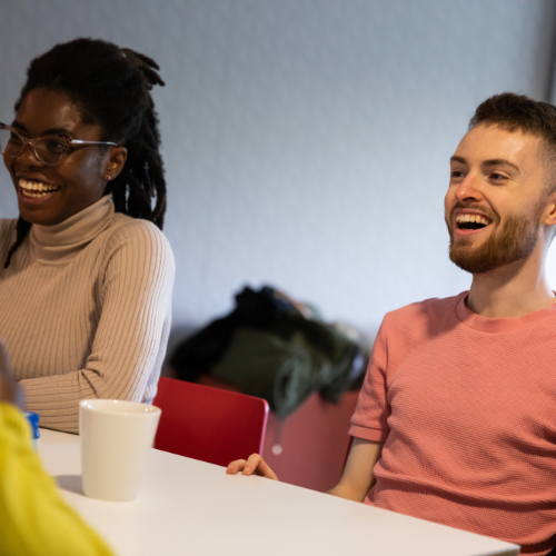 Two students laughing