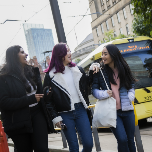 Three students exploring Manchester city centre