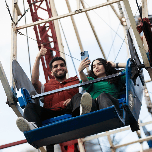 Two students on a ferris wheel