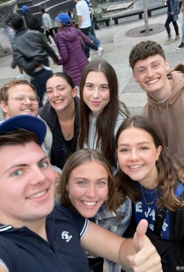 A group of seven friends smiling at the camera
