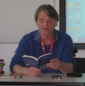 Photograph of academic reading novel at conference